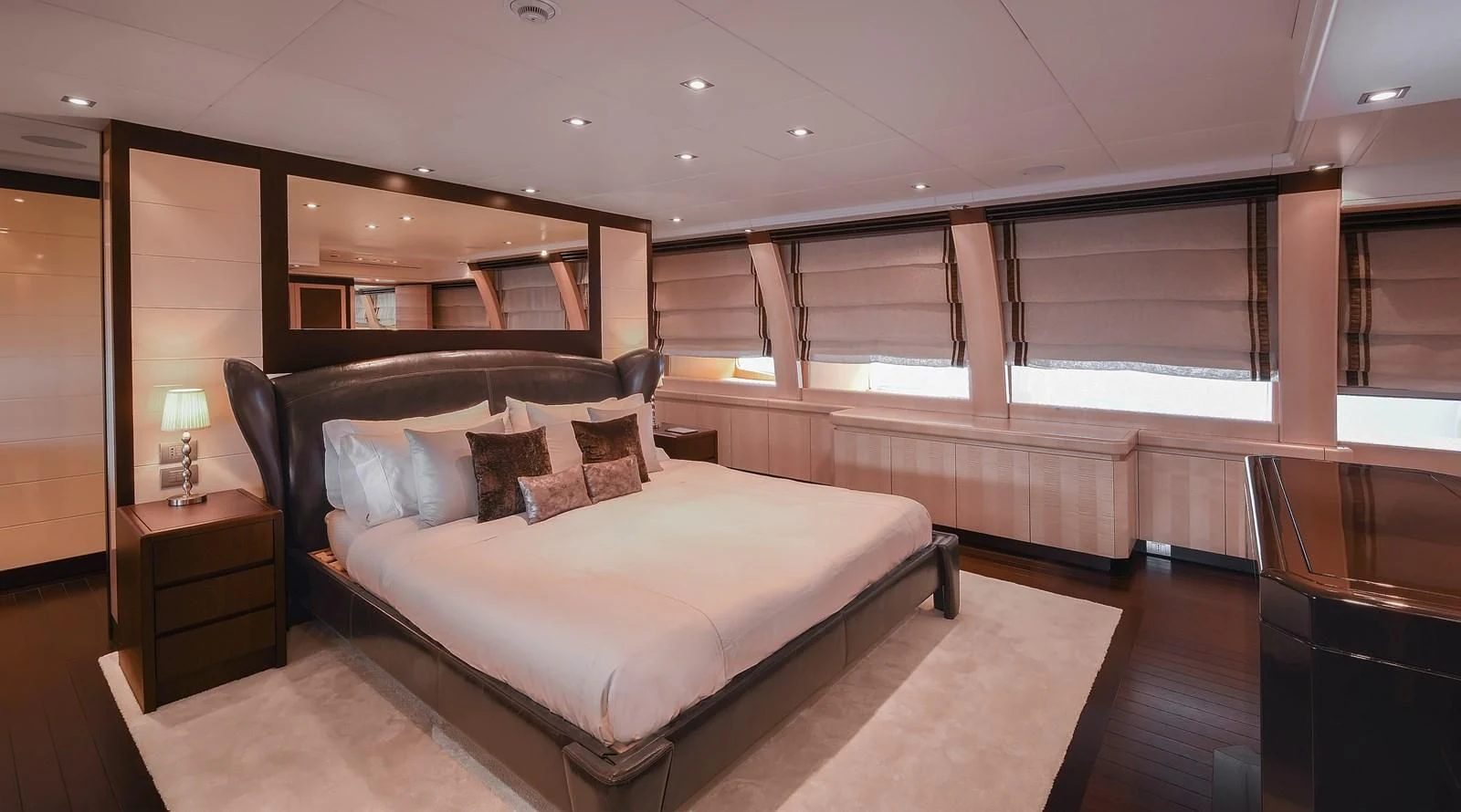a large bedroom with a large bed aboard LIBERDADE Yacht for Sale