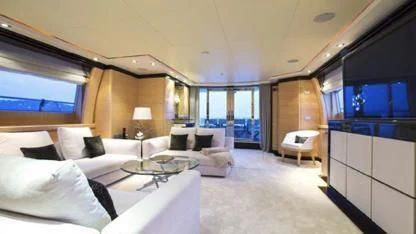 a room with a bed and a table aboard LIBERDADE Yacht for Sale