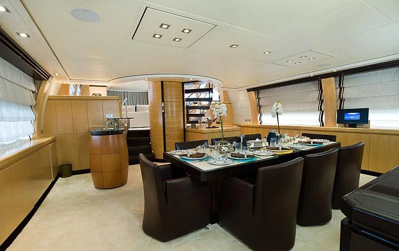 a room with a table and chairs aboard LIBERDADE Yacht for Sale