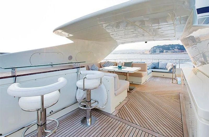 a room with a table and chairs aboard LIBERDADE Yacht for Sale
