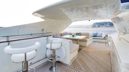 a room with a table and chairs aboard LIBERDADE Yacht for Sale