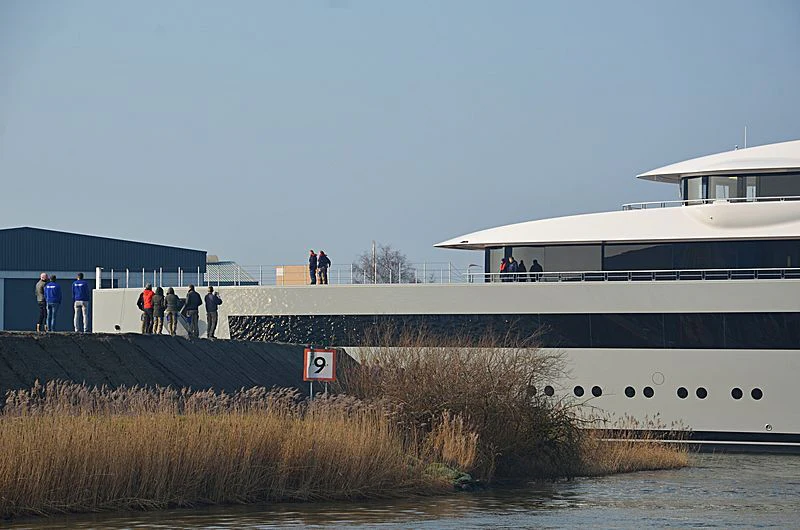 people standing on a dock next to a large white boat aboard MOONRISE Yacht for Sale
