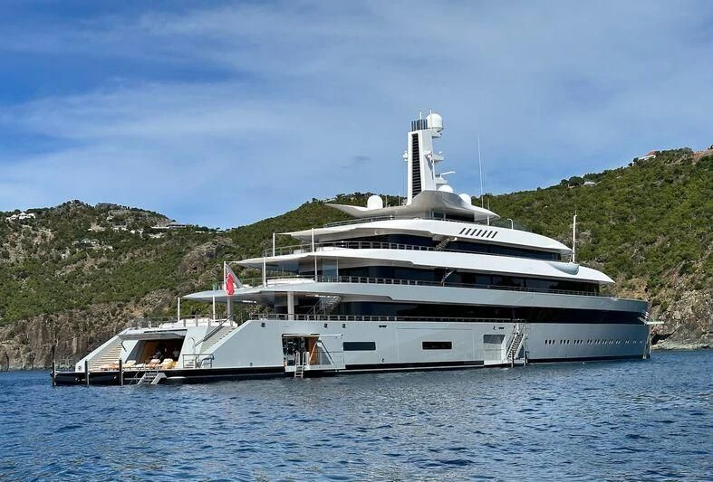 a large white boat on the water aboard MOONRISE Yacht for Sale