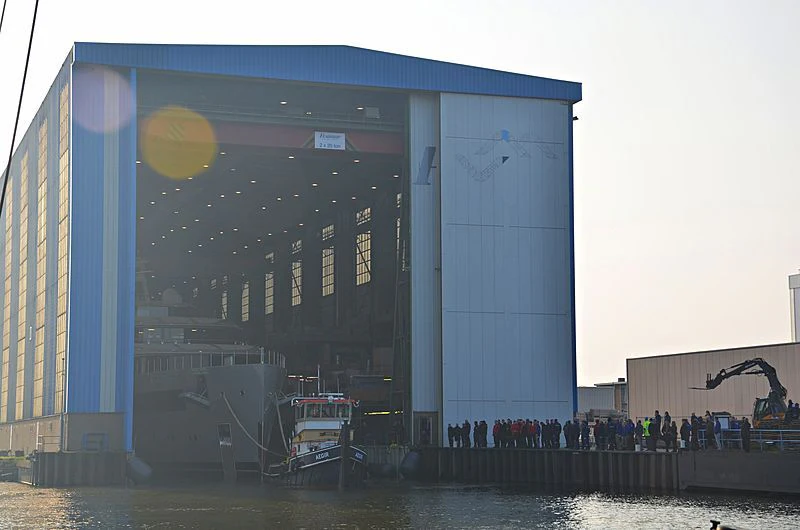 a group of people standing outside a building aboard MOONRISE Yacht for Sale