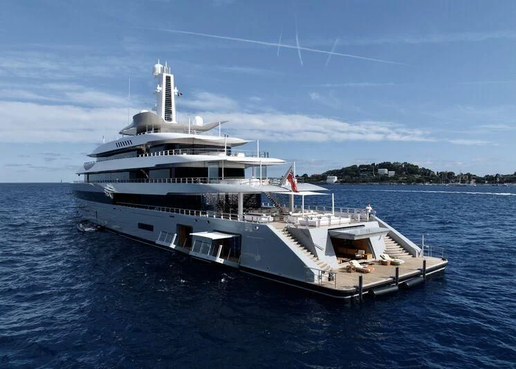 a large white boat on the water aboard MOONRISE Yacht for Sale