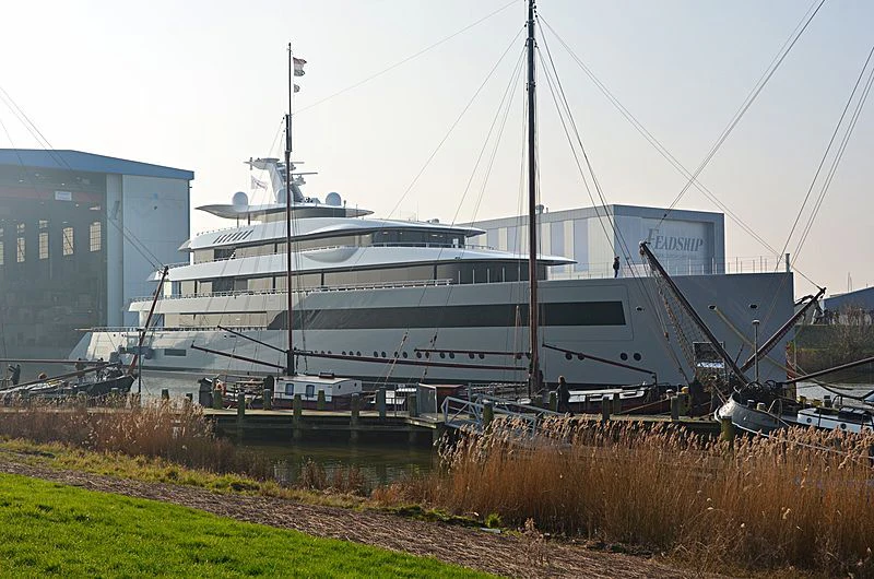 a large white ship docked aboard MOONRISE Yacht for Sale