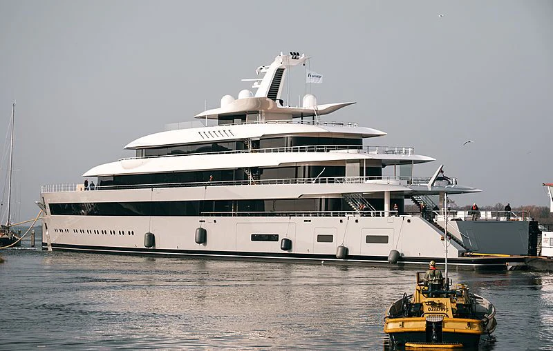 a large white ship docked aboard MOONRISE Yacht for Sale