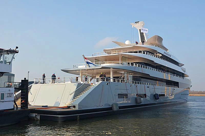 a large cruise ship docked aboard MOONRISE Yacht for Sale