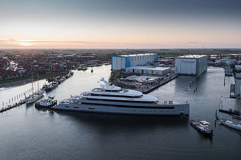 a large ship docked at a port aboard MOONRISE Yacht for Sale