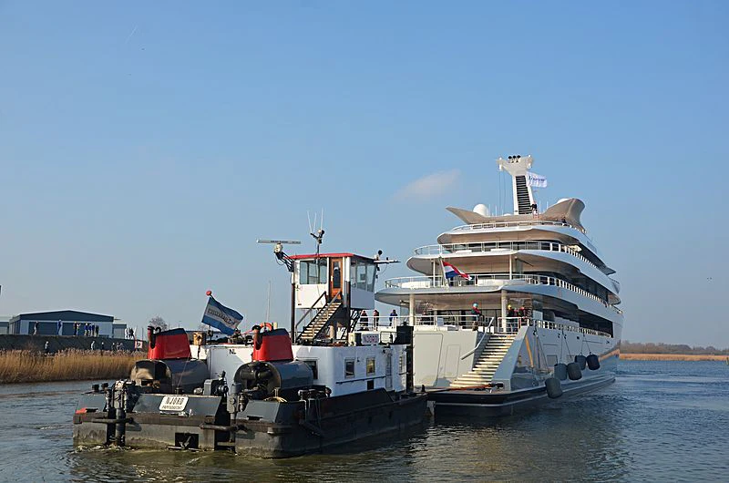 a large boat on a body of water aboard MOONRISE Yacht for Sale