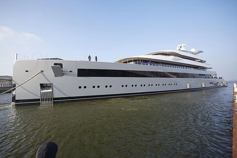a large white cruise ship docked aboard MOONRISE Yacht for Sale