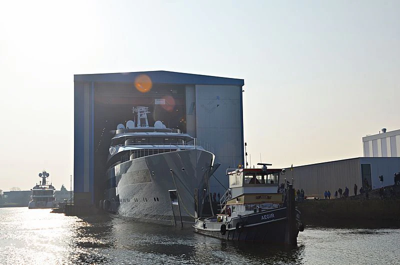 a large ship docked at a pier aboard MOONRISE Yacht for Sale