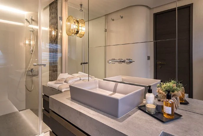 a bathroom with a bathtub and a sink aboard NUMARINE 26XP/24 Yacht for Sale