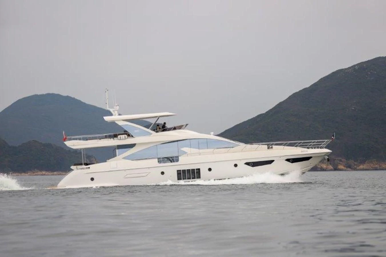a white yacht on the water aboard AZIMUT 80 FLYBRIDGE Yacht for Sale