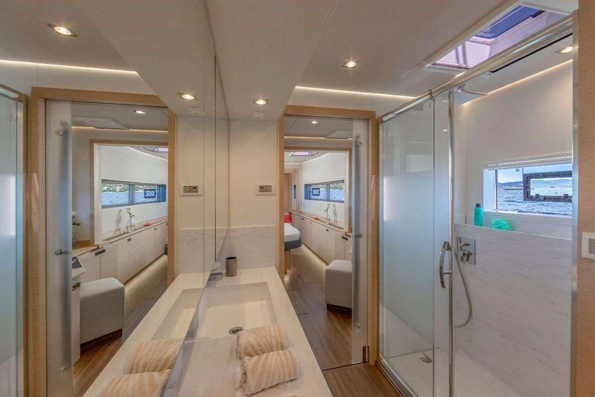 a long hallway with glass doors aboard STEPHANIE Yacht for Charter