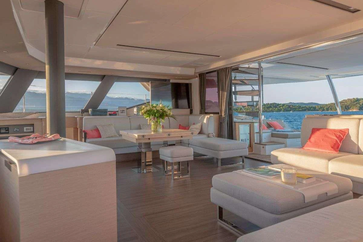 a room with a table and couches aboard STEPHANIE Yacht for Charter
