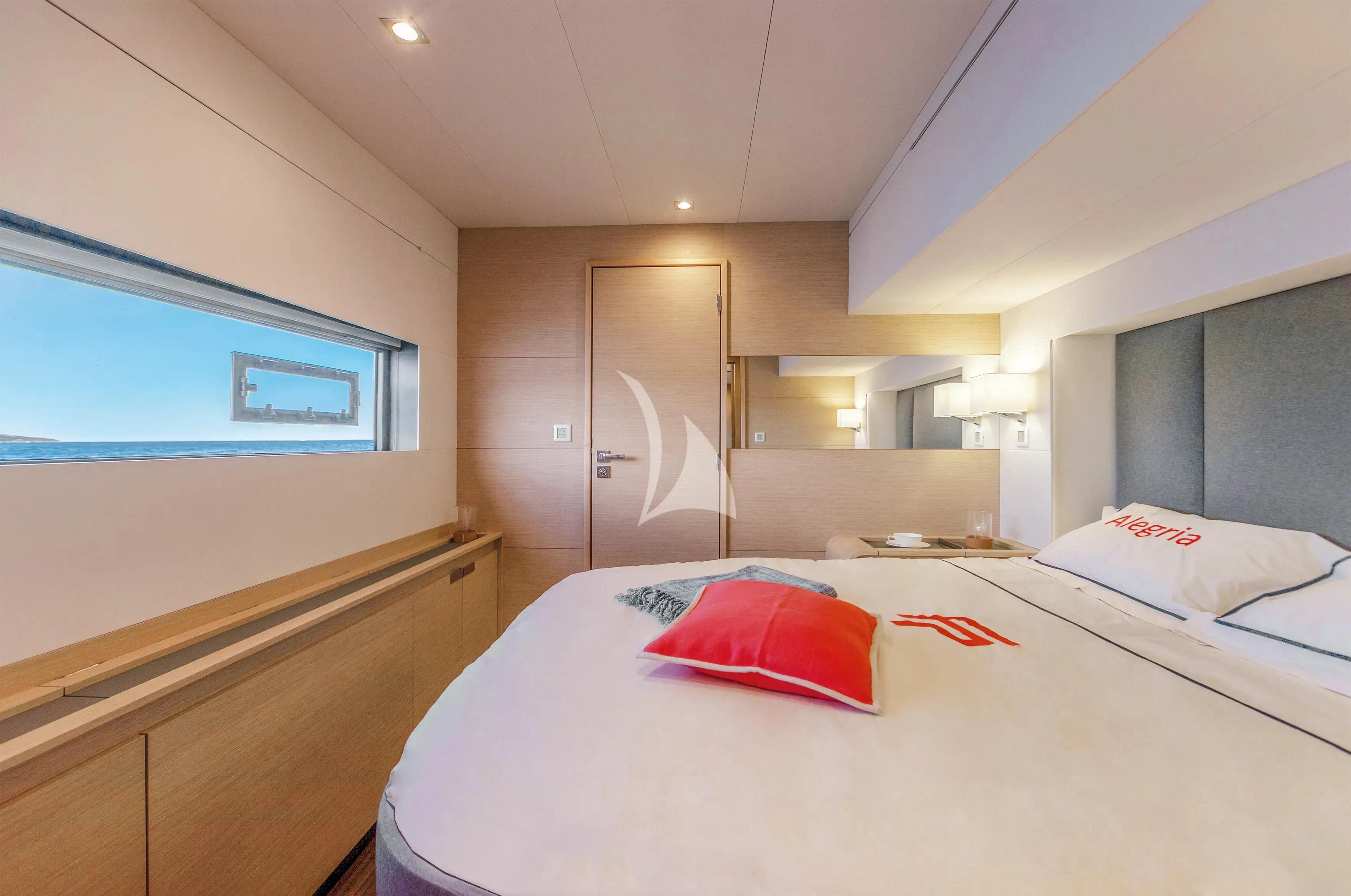 a bedroom with a bed and a desk aboard STEPHANIE Yacht for Charter