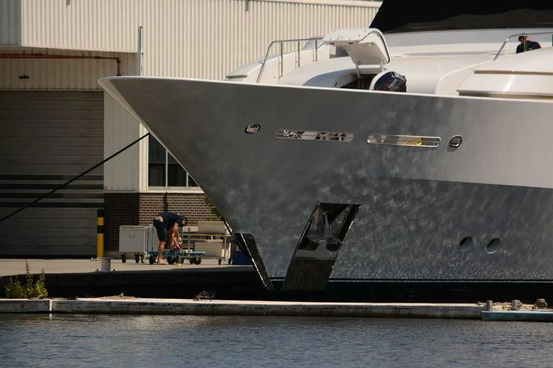 a person standing on a boat aboard GO Yacht for Sale