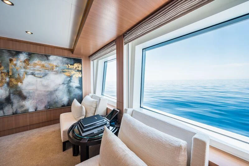 a room with a large painting aboard GO Yacht for Sale