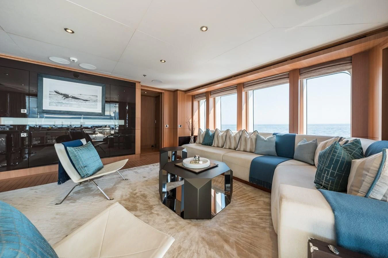 a living room with a couch and a tv aboard GO Yacht for Sale