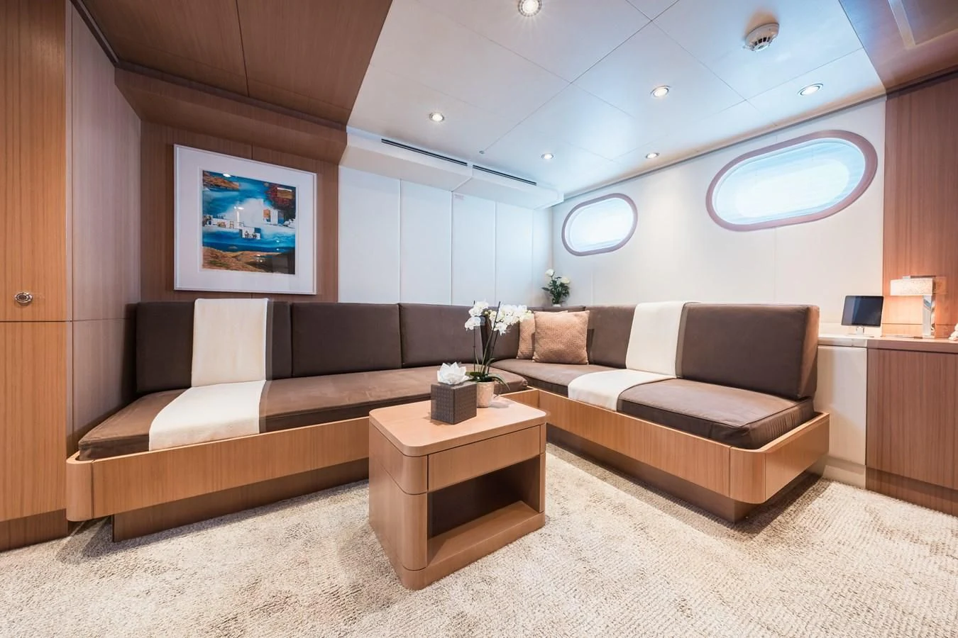 a living room with a couch and a coffee table aboard GO Yacht for Sale