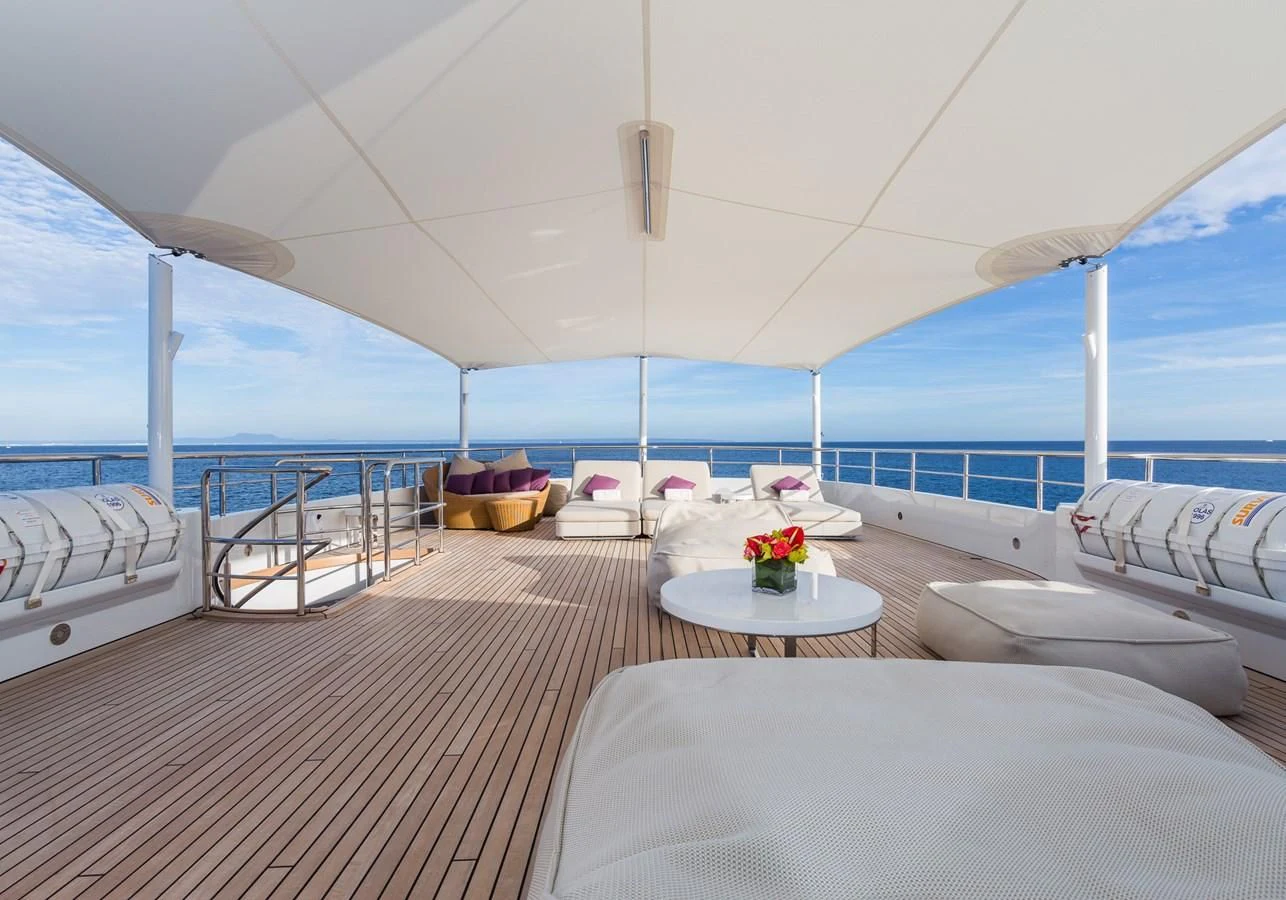 a room with a view of the ocean and the deck aboard GO Yacht for Sale