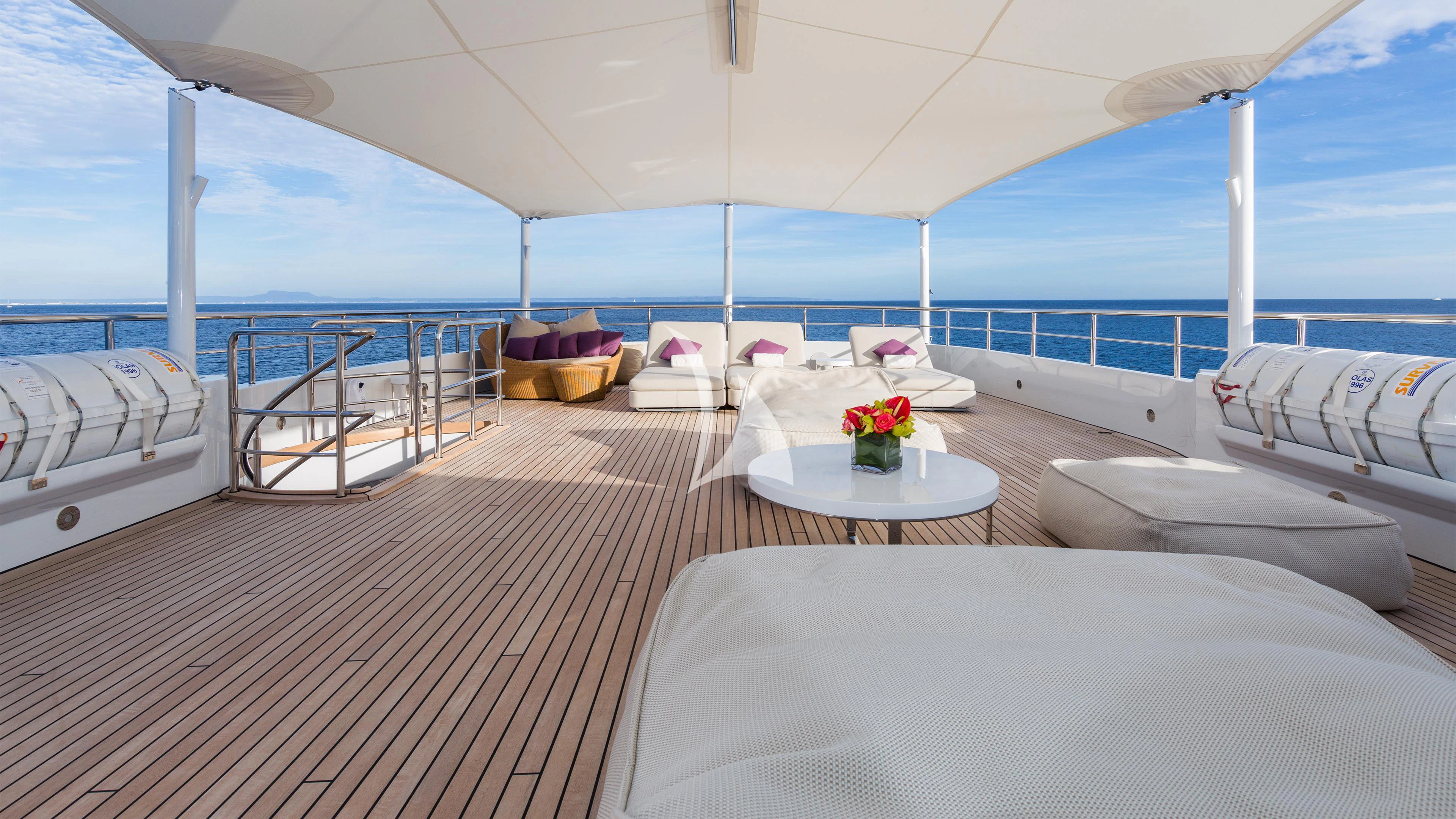 a room with a table and chairs aboard GO Yacht for Sale