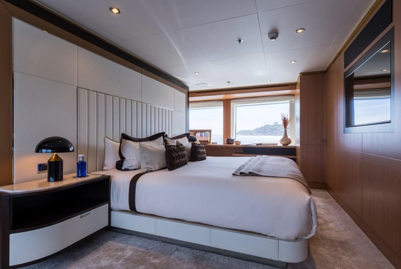a large bed in a room aboard GO Yacht for Sale