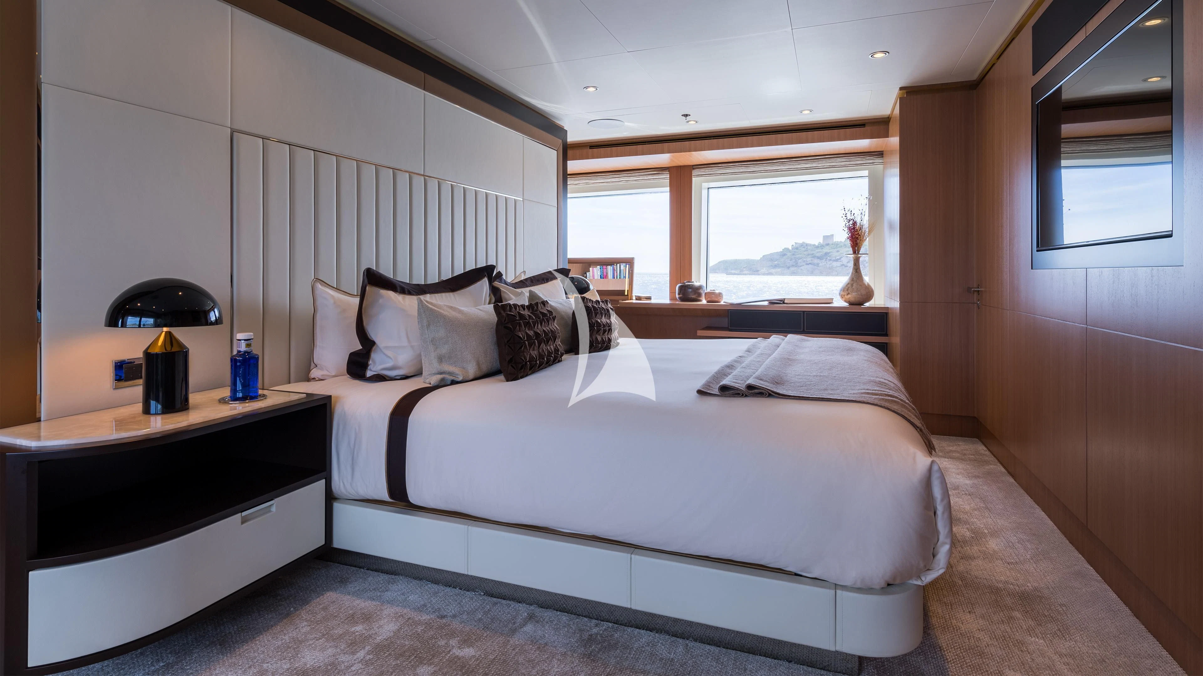 a bed with white sheets aboard GO Yacht for Sale