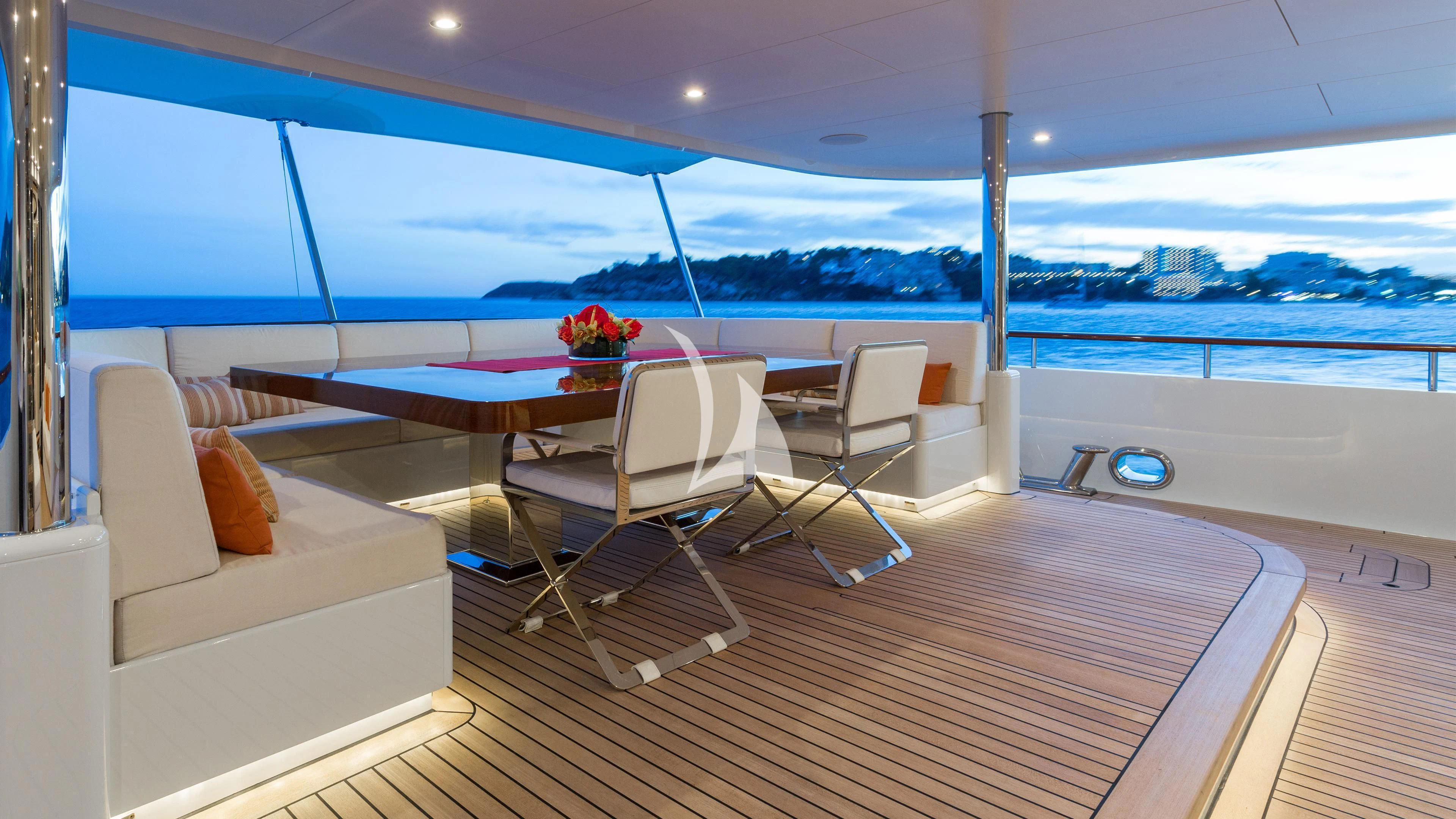 a room with a table and chairs aboard GO Yacht for Sale