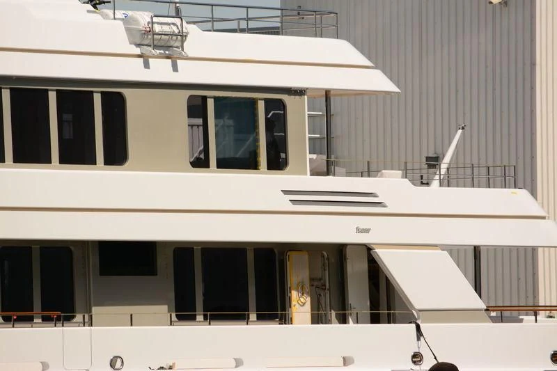 a white building with windows aboard GO Yacht for Sale