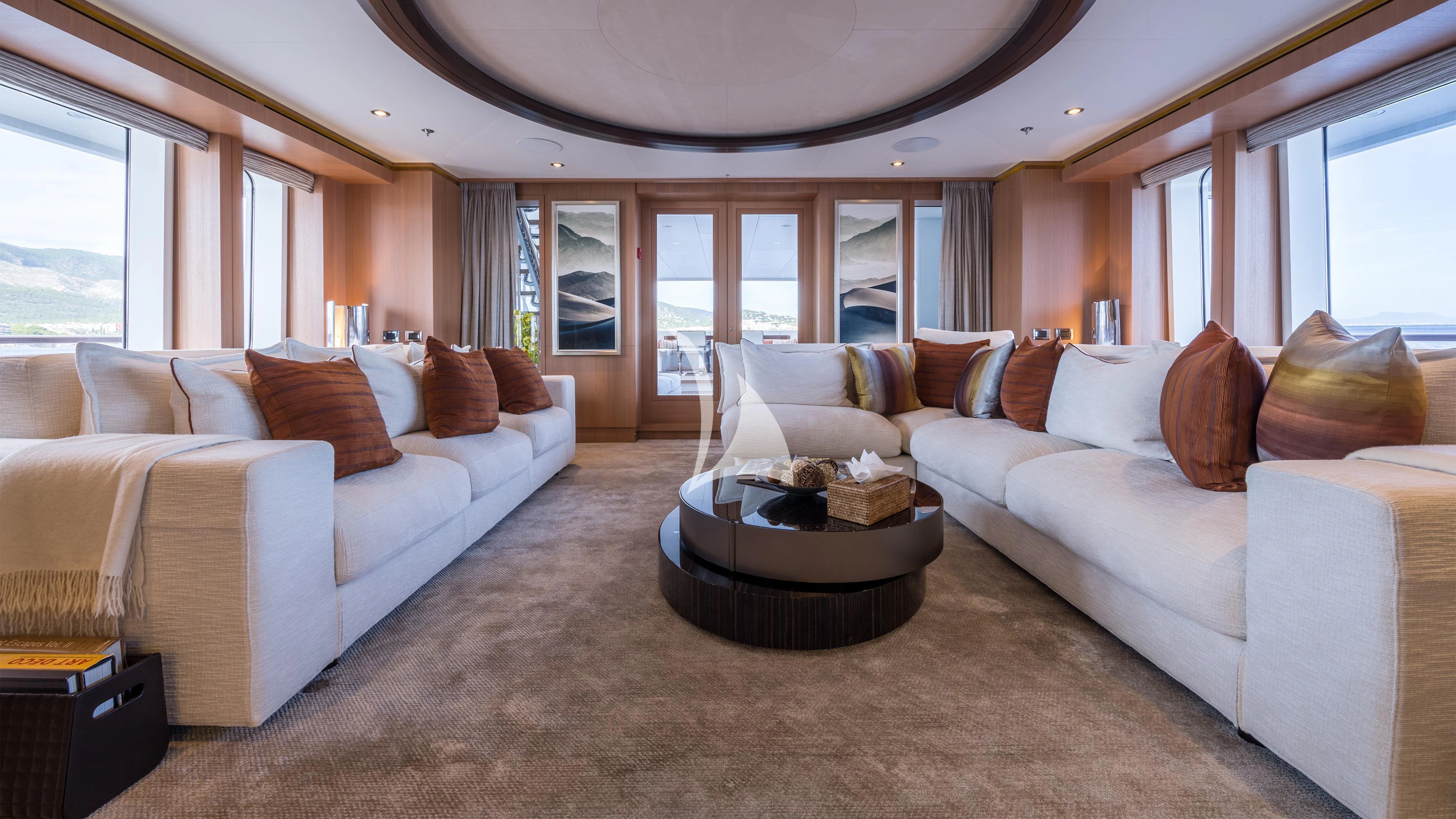 a living room with a couch and a table aboard GO Yacht for Sale