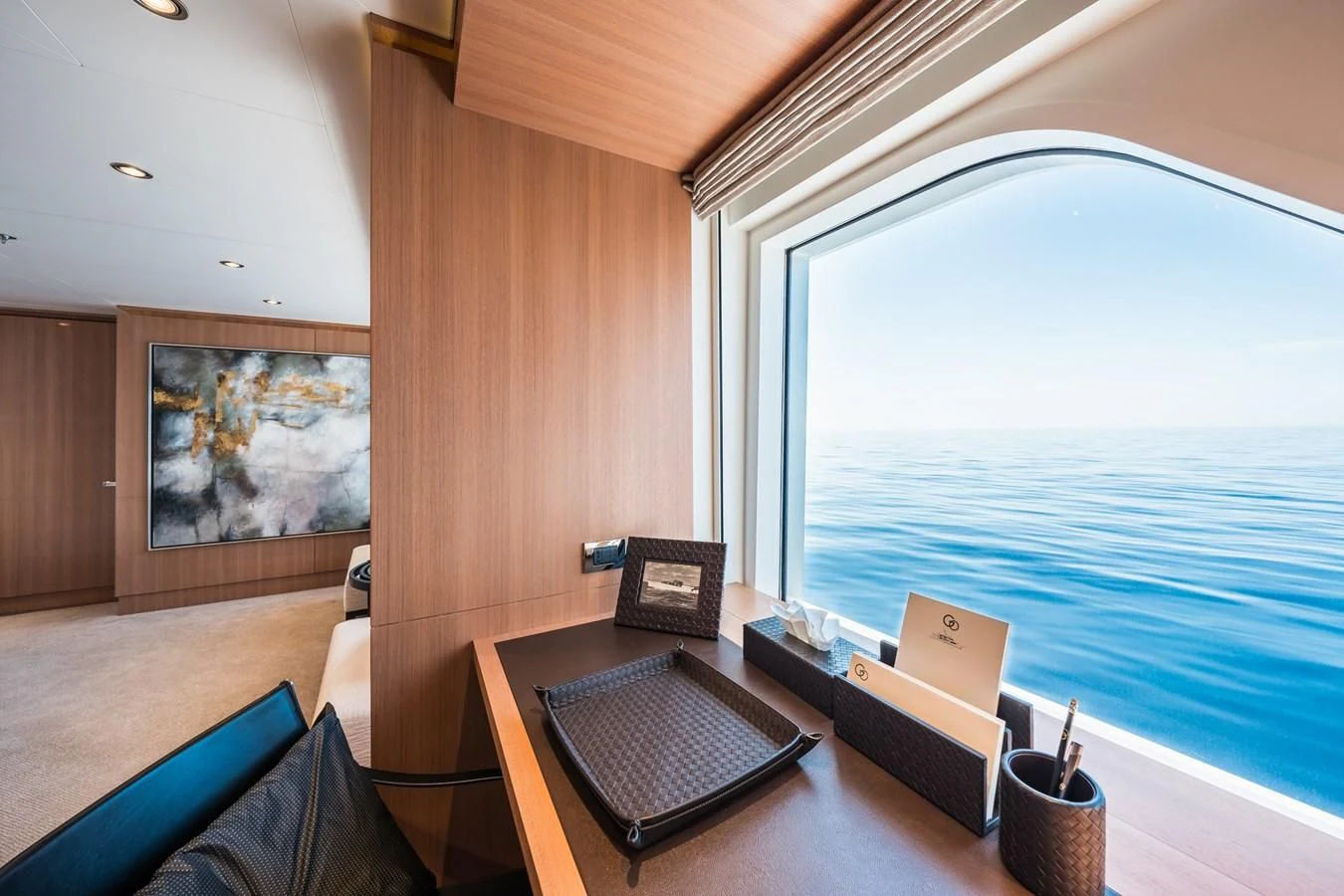 a room with a table and chairs aboard GO Yacht for Sale