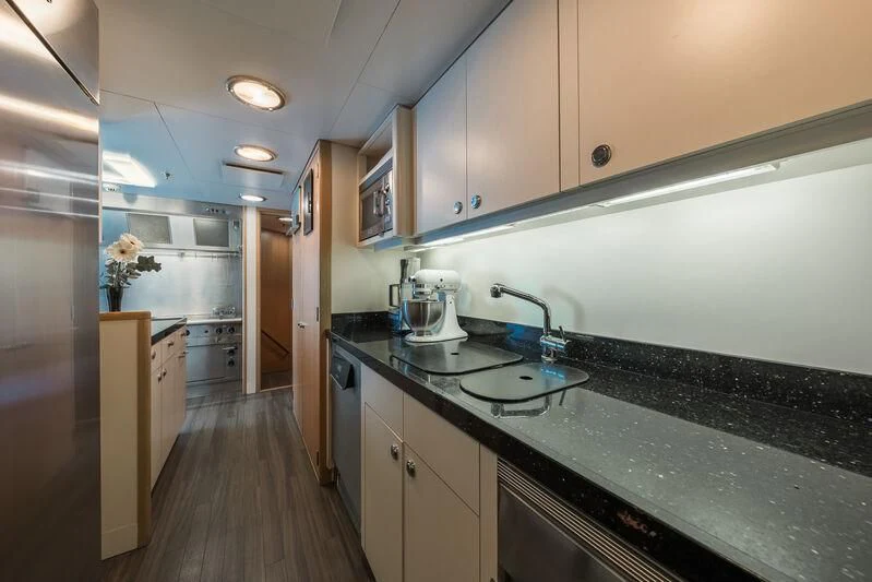 a kitchen with a large island aboard GO Yacht for Sale