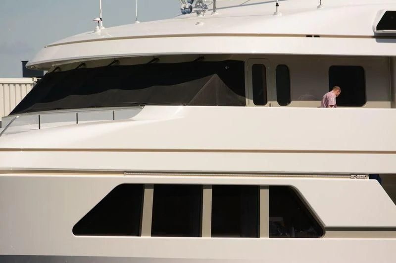 a person standing in a white boat aboard GO Yacht for Sale