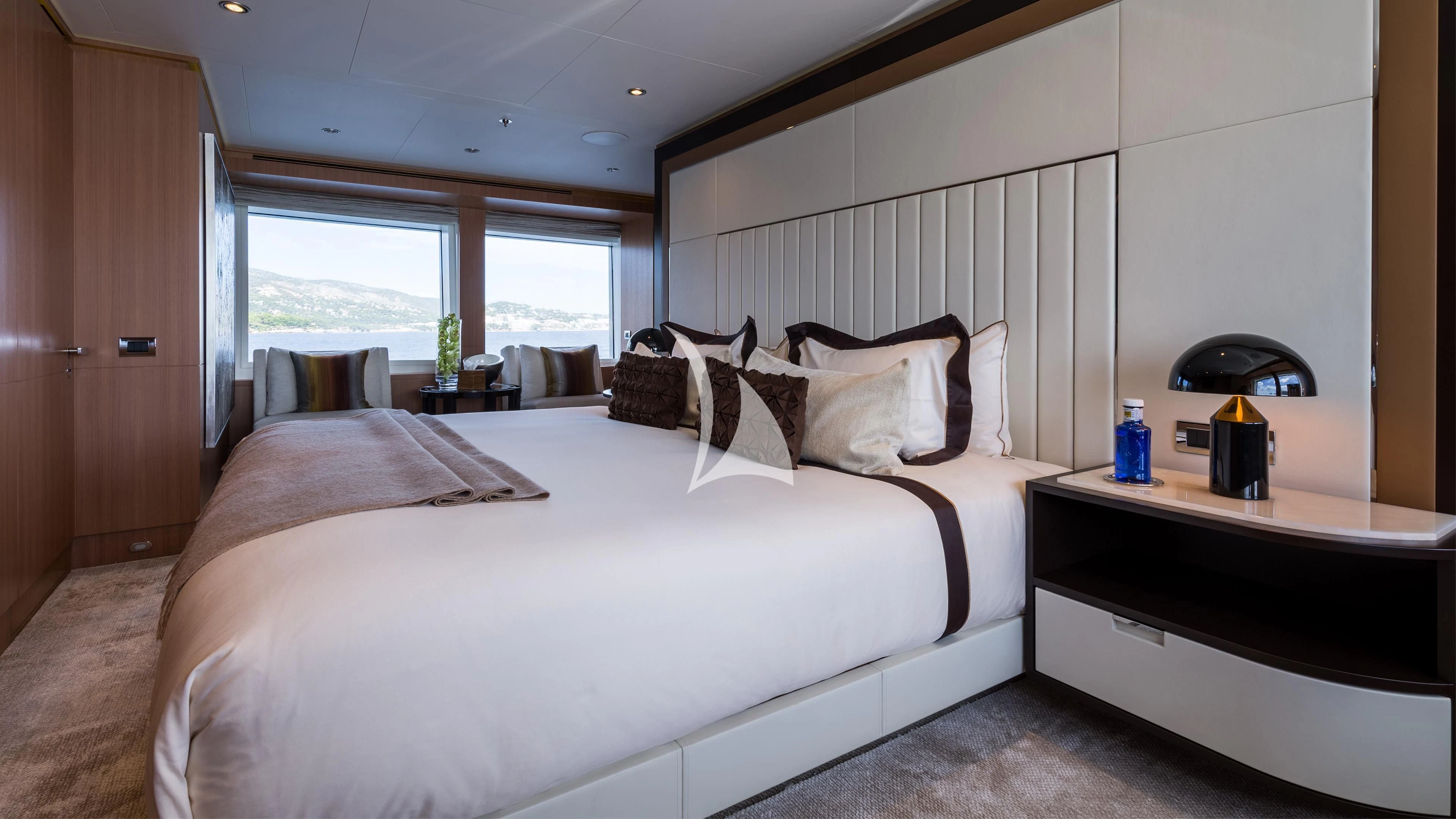 a bedroom with a large bed aboard GO Yacht for Sale