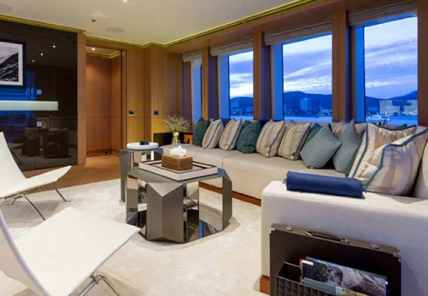 a living room with a couch and a table aboard GO Yacht for Sale