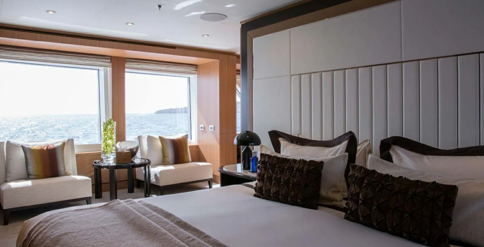 a large bed with pillows aboard GO Yacht for Sale