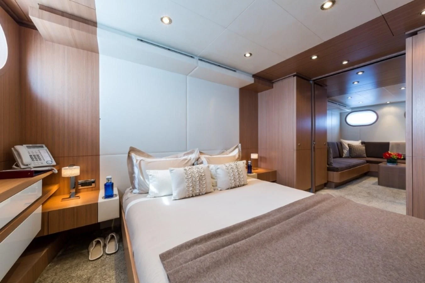 a hotel room with a bed and a desk aboard GO Yacht for Sale