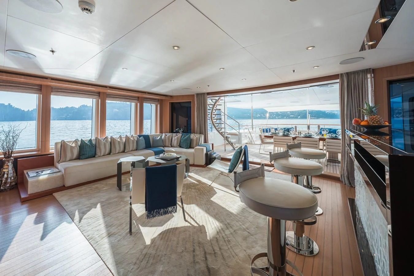 a living room with a large window aboard GO Yacht for Sale