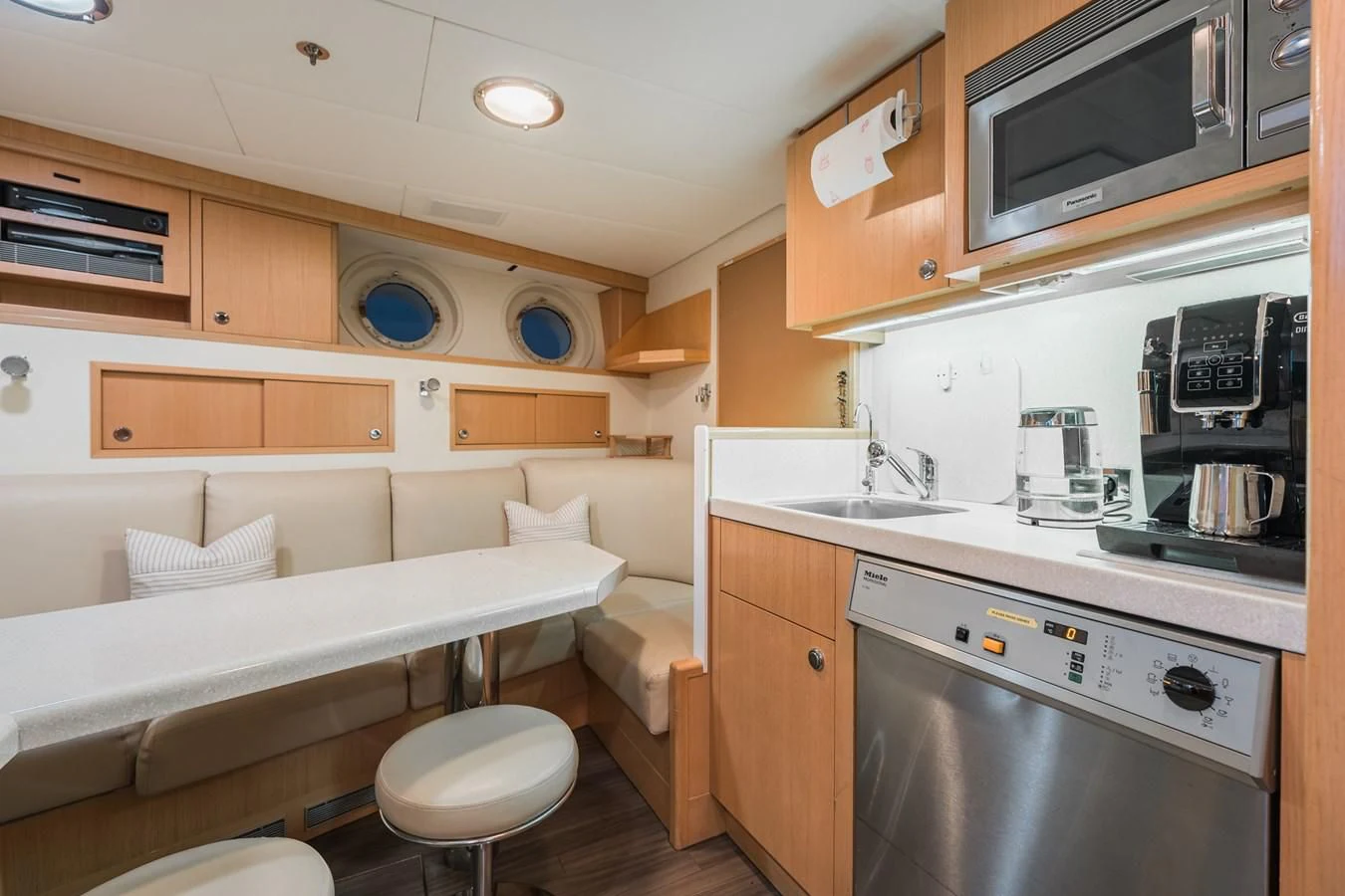a kitchen with a bed and a sink aboard GO Yacht for Sale