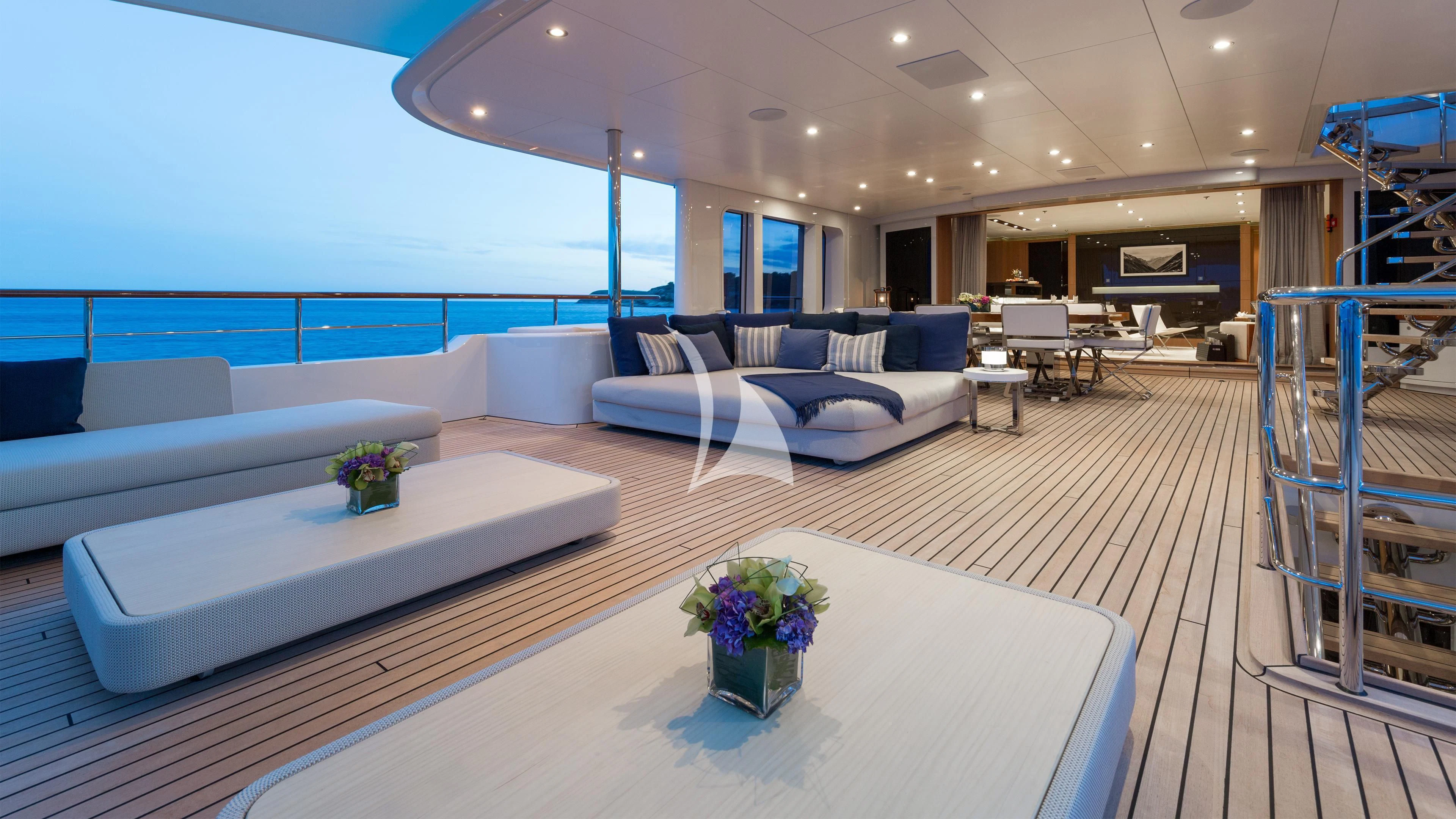 a room with a couch and a table aboard GO Yacht for Sale