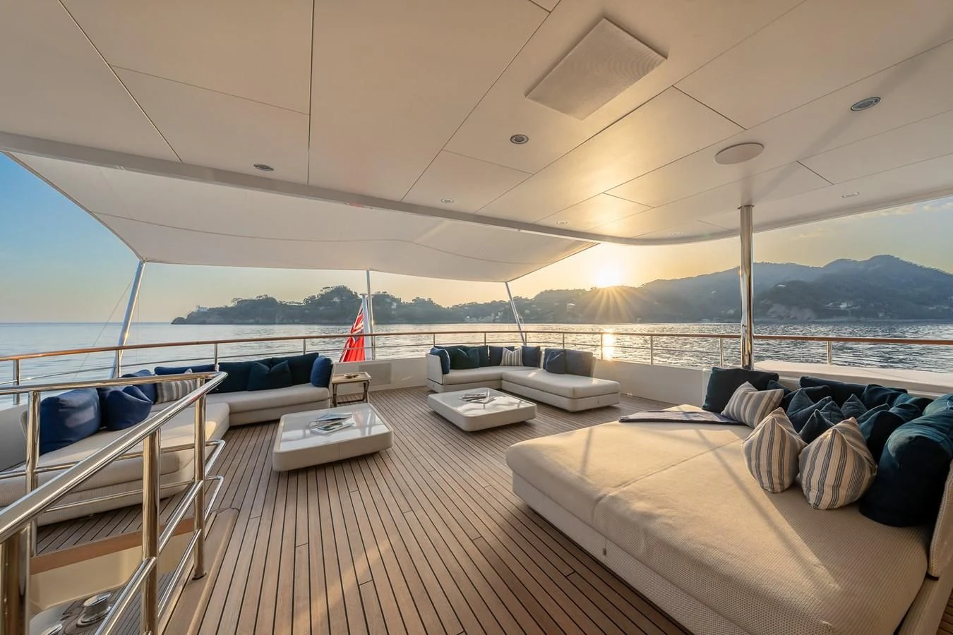 a large room with a bed and a large body of water aboard GO Yacht for Sale