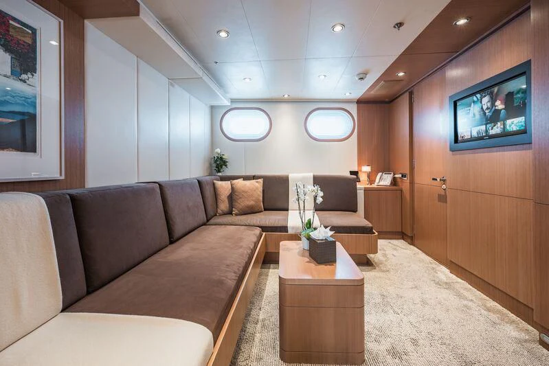 a living room with a couch and a tv aboard GO Yacht for Sale