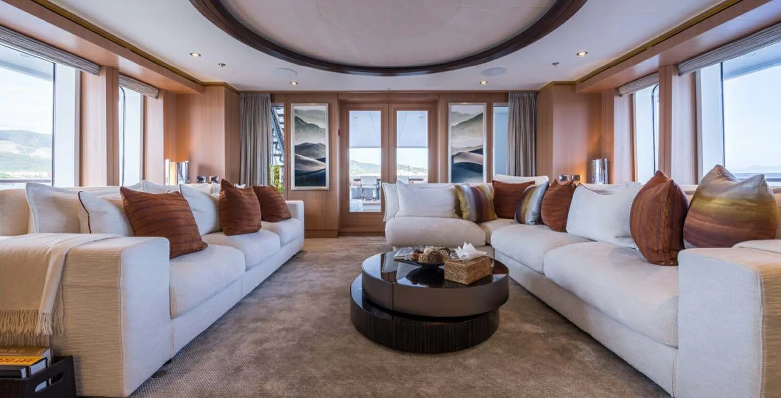 a living room with a couch and a coffee table aboard GO Yacht for Sale