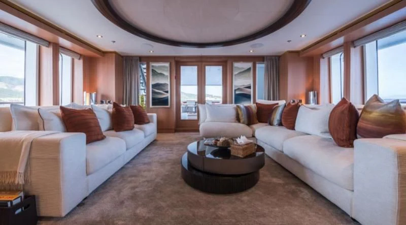a living room with a couch and a coffee table aboard GO Yacht for Sale