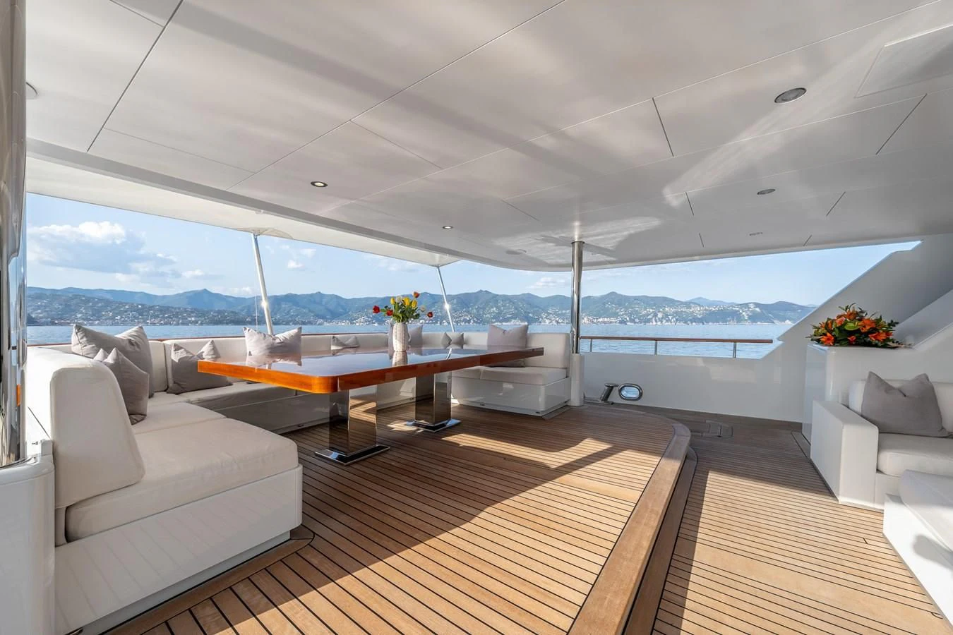 a room with a couch and a table aboard GO Yacht for Sale