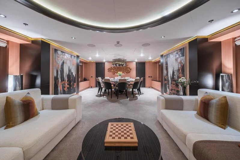 a living room with a couch and a table aboard GO Yacht for Sale