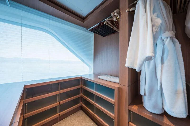 a room with a closet and a bed aboard GO Yacht for Sale