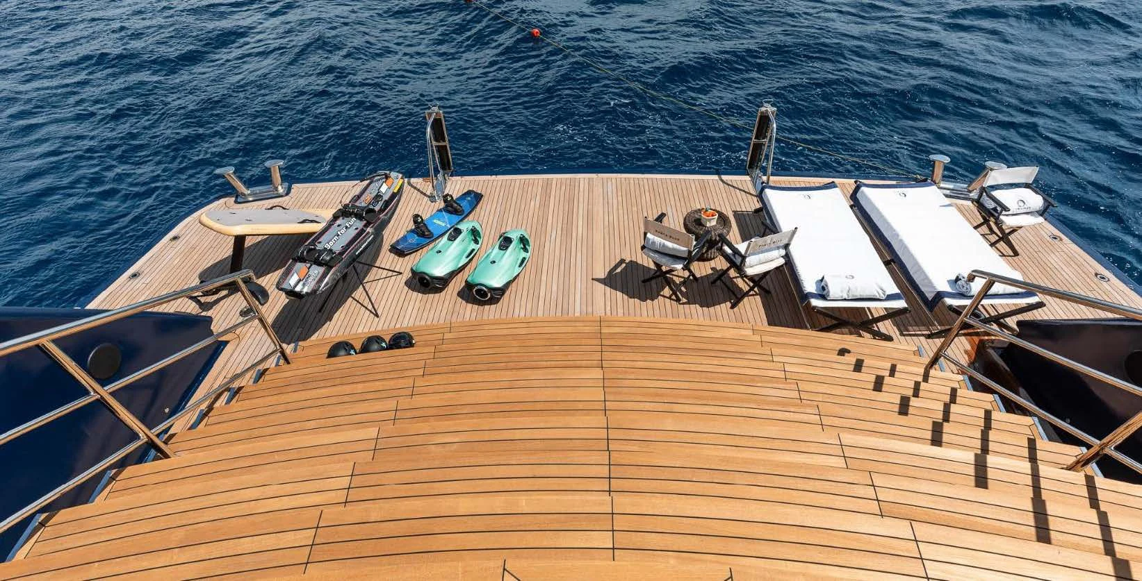 a deck with chairs and boats on it aboard FORCE BLUE Yacht for Charter